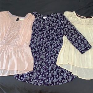 Trio of blouses. Pink, blue, cream.